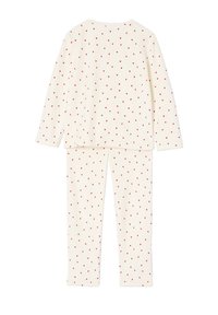 Cream-colored pajamas made of soft fabric, featuring a repeated red heart pattern. Includes a long-sleeve top and matching pants.
