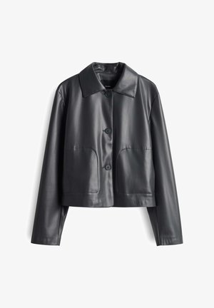 Black faux leather cropped jacket with a collar, front button closure, and two large side pockets. Smooth texture and minimalist design.