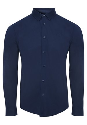 Marineblauwe langemouwen shirt van gladde stof, met een knoopsluiting aan de voorkant, een puntige kraag en een klein geborduurd logo op de borst.