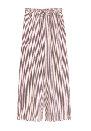 Loszittende broek met rode en witte verticale strepen en een elastische tailleband met aantrekkoord.