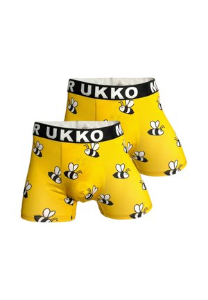 Calzoncillos bóxer amarillos con estampado de abejas en blanco y negro y cinturillas negras con texto blanco "MUKKO", mostrados uno al lado del otro.