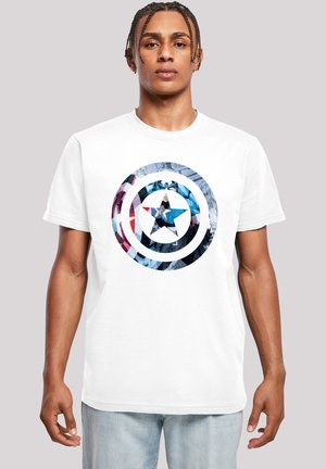 White t-shirt featuring a circular graphic design with a blue star at the center. The graphic includes red, white, and blue details.