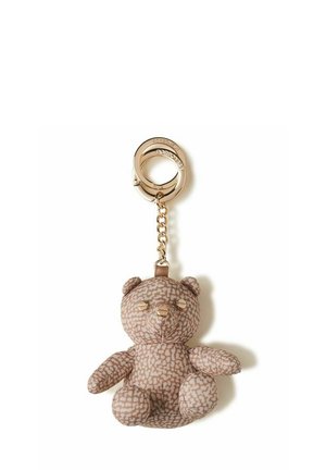 Portachiavi con un morbido orsetto in tessuto beige fantasia e anello metallico dorato con catenina.