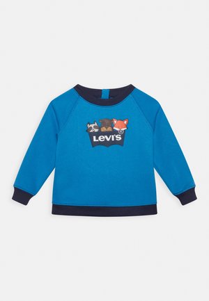 Sweatshirt bleu avec des poignets et un col marine, présentant un graphique de trois animaux et le logo "Levi's" sur le devant. Matière en mélange de coton.