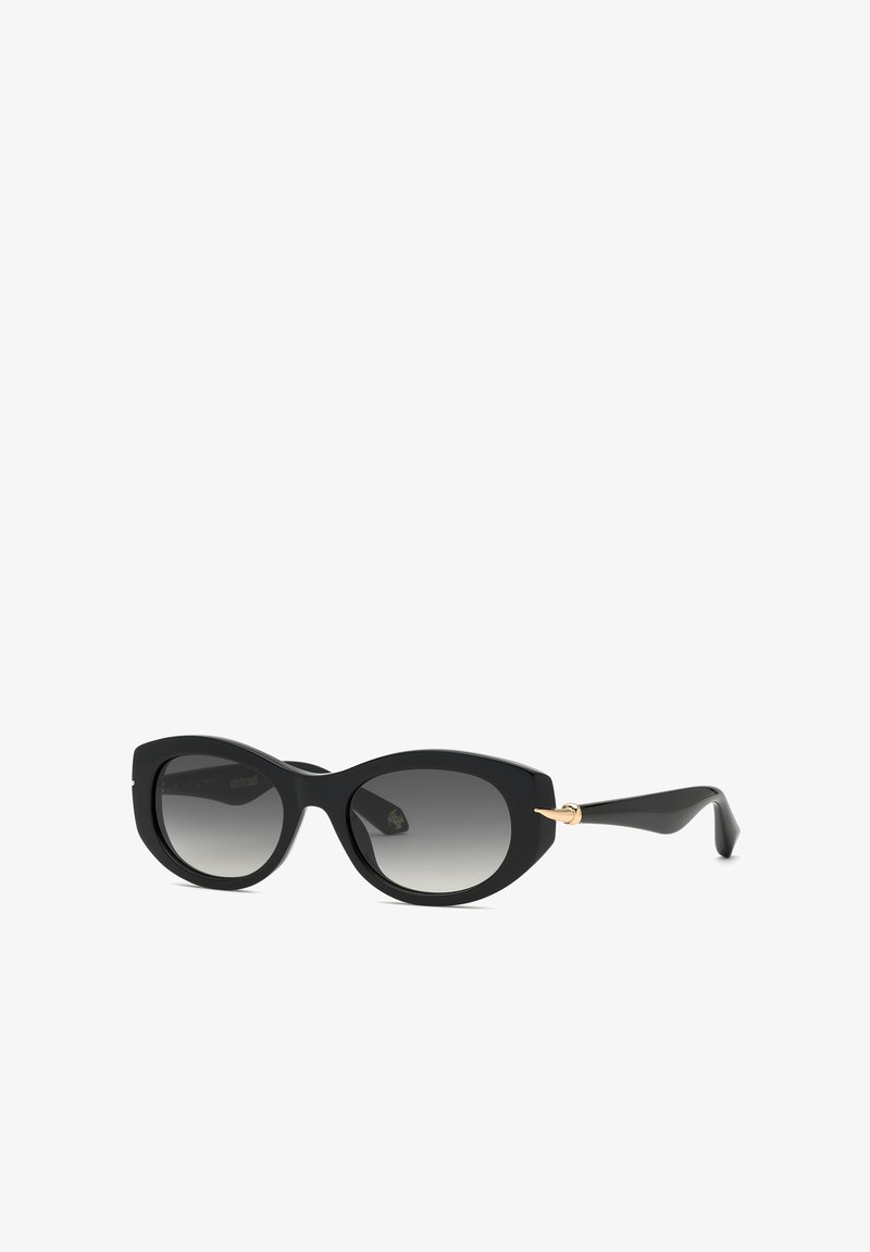 Lunettes de soleil œil-de-chat noires avec verres gris dégradés et détail doré sur les branches, présentées sur fond blanc.