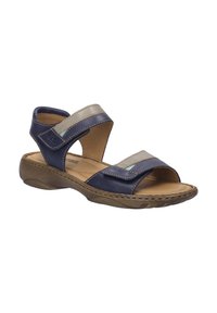 Dunkelblaue Ledersandalen mit zwei überkreuzten Riemen, beigen Akzenten, einer gepolsterten Innensohle und einer strukturierten Gummisohle.