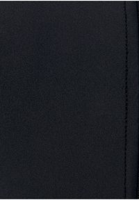 Black, textured fabric showing a seamless pattern; features a smooth surface with visible stitching along the edge.