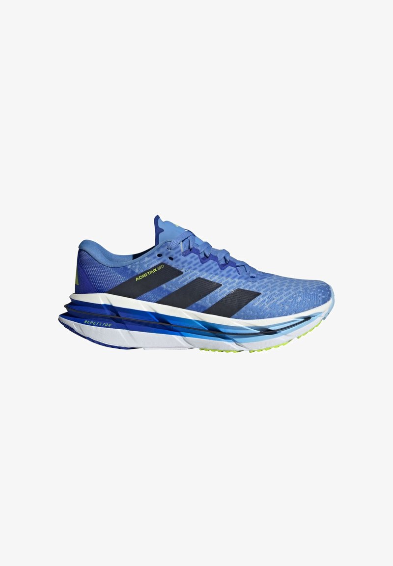 Light blue running shoe with mesh upper, black accents, and a textured sole. Features a cushioned white midsole and green outsole.