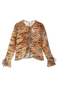 Tiger-print blouse made of lightweight fabric, featuring a V-neck, front ties, and gathered cuffs with ribbon detail. Predominantly orange and black.