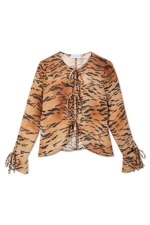 Tiger-print blouse made of lightweight fabric, featuring a V-neck, front ties, and gathered cuffs with ribbon detail. Predominantly orange and black.