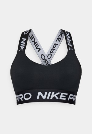 Sutien sport negru cu textură netedă. Prezintă bretele încrucișate și o bandă lată cu logo-ul "NIKE PRO" în litere albe.
