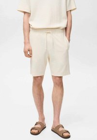 Mango XAVIS - Teplákové kalhoty - off-white