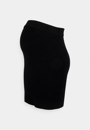 Falda de punto negra de canalé con un diseño ajustado y una cinturilla negra sólida. Presenta una textura suave y un corte hasta la rodilla.