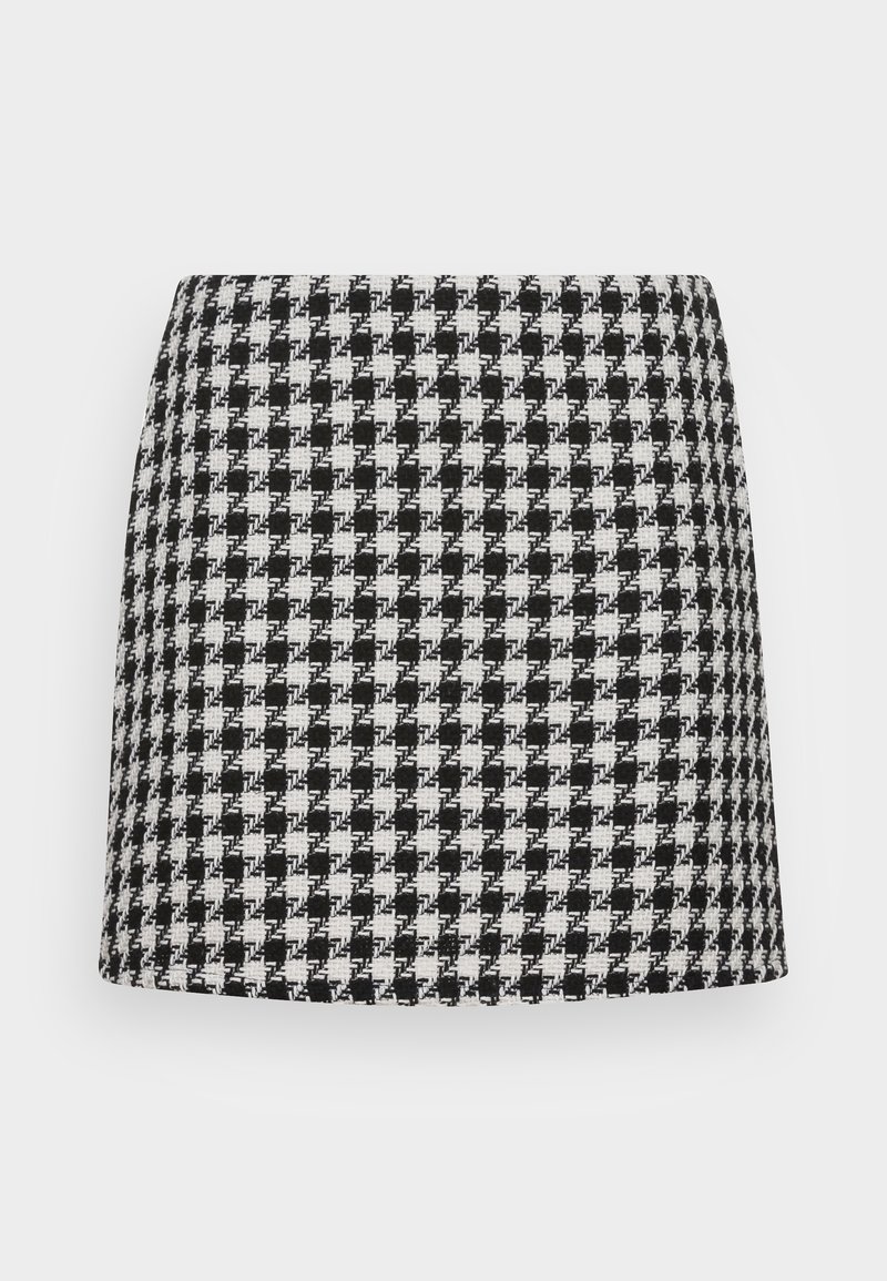 Mini-jupe droite à motif pied-de-poule noir et blanc en tissu texturé, présentée sur un fond blanc uni.