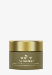 Grønn glasskrukke med gullokk, merket "ORIGINS PLANTSCRIPTION™." Inneholder rynkekorrigerende øyekrem med en jevn overflate.