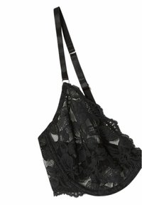 Svart spetsbralette med mjuka kupor och justerbara sidenband. Har en blommig spetsmönster och vågiga kanter. Ingen bygel.