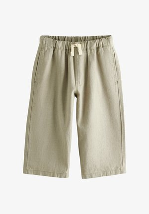 Lyse beige, løstsiddende shorts med elastik i taljen, snørredetalje og sidelommer; tekstureret stof med en blød finish.