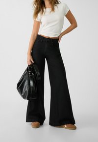 Stradivarius Jeans a zampa - black denim