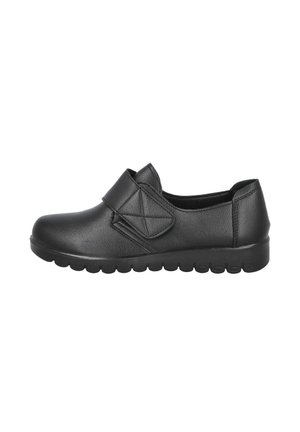 Zapato negro sin cordones con parte superior de cuero texturizado, una correa de Velcro en el empeine y una suela de goma segmentada y acolchada.