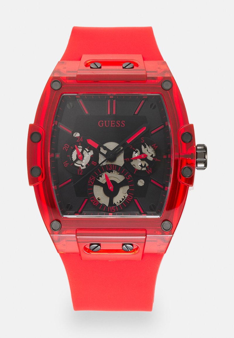 Red transparent watch with a black dial, three subdials, and red accents. Features a rubber strap and silver-tone hardware with angular shape.
