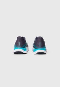 Running shoes featuring a dark purple mesh upper, turquoise accents, and a white sole with textured black traction.
