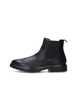 Stivale Chelsea in pelle nera con pannelli elastici laterali, punta rotonda e suola in gomma testurizzata per una buona presa. Linguetta per una facile calzata.