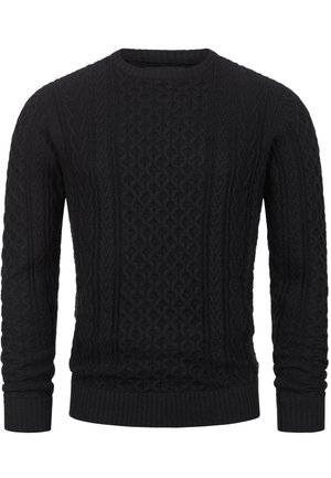 Svart strikket genser med teksturerte kabelmønstre, rund hals og ribbestrikket mansjetter og hem. Stoffet ser mykt ut og gir et koselig inntrykk.