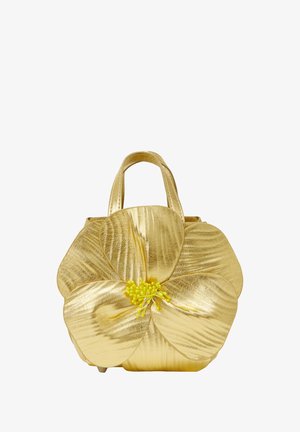 Gold metallic handbag featuring a flower design with textural petals and a yellow central accent. Short handles for carrying.
