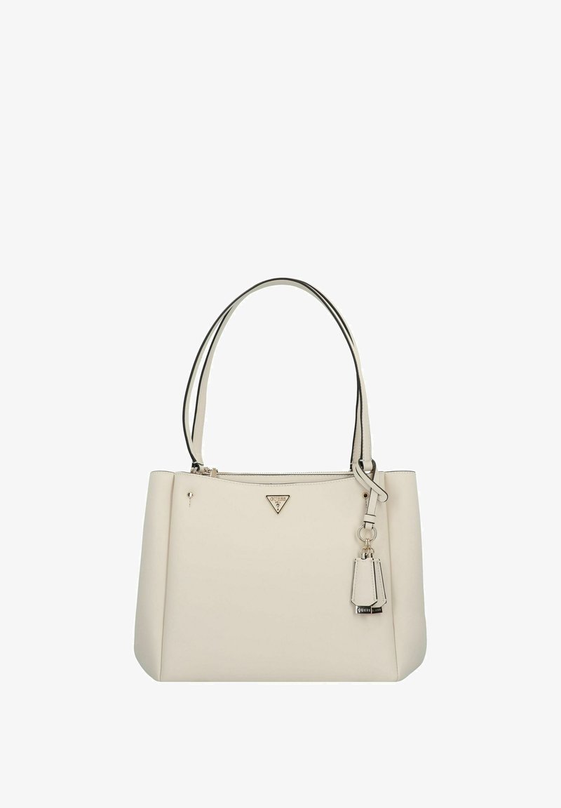 Borsa tote in pelle crema con manici doppi, chiusura con zip e un accento di logo argento. Presenta un charm removibile e una texture liscia.