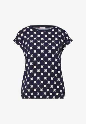 Marineblaue und weiße Kurzarmbluse mit großem Polka-Punkt-Muster und elastischem Saum.