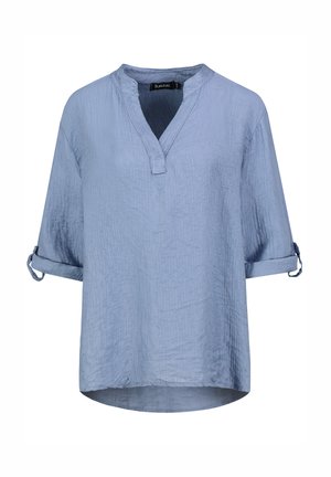 Light blue shirt made of textured fabric. Features a V-neck, three-quarter sleeves with rolled cuffs, and a curved hemline.