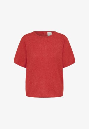 Raudona trumpomis rankovėmis megzta marškinėliai su apvali iškirpte. Charakterizuojasi švelniu paviršiumi ir laisvu pritaikymu, su minimaliais akcentais.