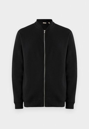 Felpa nera con zip e collo rialzato, polsini a costine e una texture liscia. Presenta una zip argento e nessun motivo visibile.