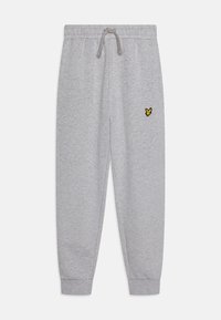 Grå joggebukser laget av mykt stoff, med elastisk linning og snor, ribbede mansjetter, og en liten gul sommerfugl-logo.