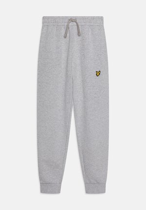 Pantalons de survêtement gris en tissu doux, dotés d'une taille élastique avec cordon de serrage, de poignets côtelés et d'un petit logo de papillon jaune.