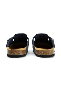 Navy blue sandals with open back, cork footbed, and textured suede upper. Adjustable strap and flat black rubber outsole.