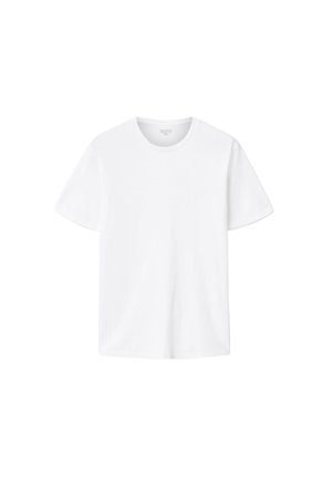 T-shirt blanc en coton à manches courtes, col rond, avec un logo discret sur la poitrine. Tissu doux et coupe décontractée.