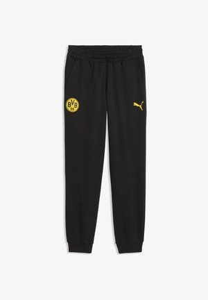 Czarne spodnie sportowe z elastycznym pasem, żółte logo Puma na prawej nodze oraz żółty emblemat BVB 09 Borussia Dortmund na lewej nodze.