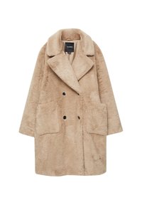 Manteau en fausse fourrure beige avec un design croisé, grandes poches et col large. Texture douce et coupe décontractée et ample.