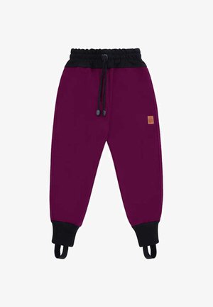 Fioletowe spodnie dresowe dla dzieci z czarnym elastycznym pasem, ściągaczami przy kostkach, sznurkami i paskami na stopach.