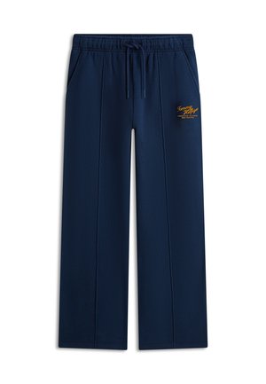 Marineblauwe sweatpants met wijde pijpen, elastische tailleband, trekkoord, zijzakken, voorsneden en een klein geel Tommy Hilfiger-logo op de linker dij.