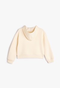 Kremowy krótki hoodie o miękkiej fakturze, z prążkowanymi mankietami i okrągłym kapturem. Prosty design bez widocznych wzorów czy akcentów.