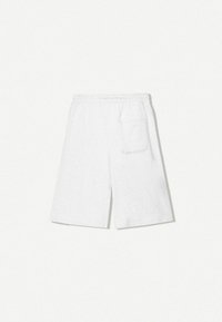 Bílé bavlněné šortky s elastickým pasem a boční kapsou, se zvýšeným střihem a měkkou texturou.
