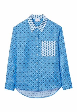 Chemise à manches longues bleu clair avec un motif floral, poche blanche contrastante, col pointu et ourlet arrondi. Confectionnée dans un tissu lisse.