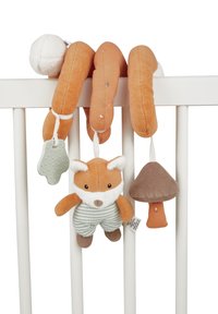 Soft plush spiral toy wrapped around crib rail, with hanging fox doll, mushroom, and silicone teether attachments in orange, brown, and white tones.