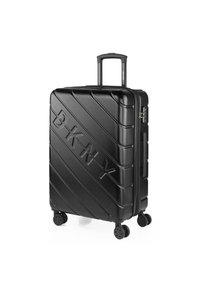 Maleta rígida negra con estrías diagonales, logo "BKNY" en relieve, asa retráctil, cuatro ruedas giratorias y asa lateral para llevar.