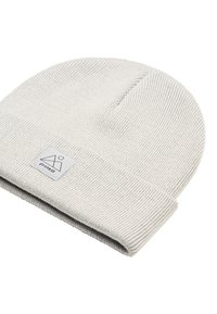 Light gray knit beanie with a folded cuff, featuring a small rectangular tag with a logo on the side. Soft texture, ribbed design.