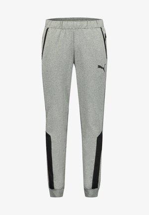 Pantalones deportivos grises con una tela texturizada, que presentan paneles laterales negros, una cinturilla elástica y bolsillos a cada lado.