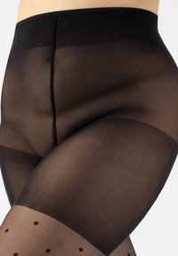 Czarne przezroczyste rajstopy o gładkiej fakturze i nieprzezroczystym pasie w talii. Ozdobione kropkami na udzie oraz subtelnymi przejściami kolorów.