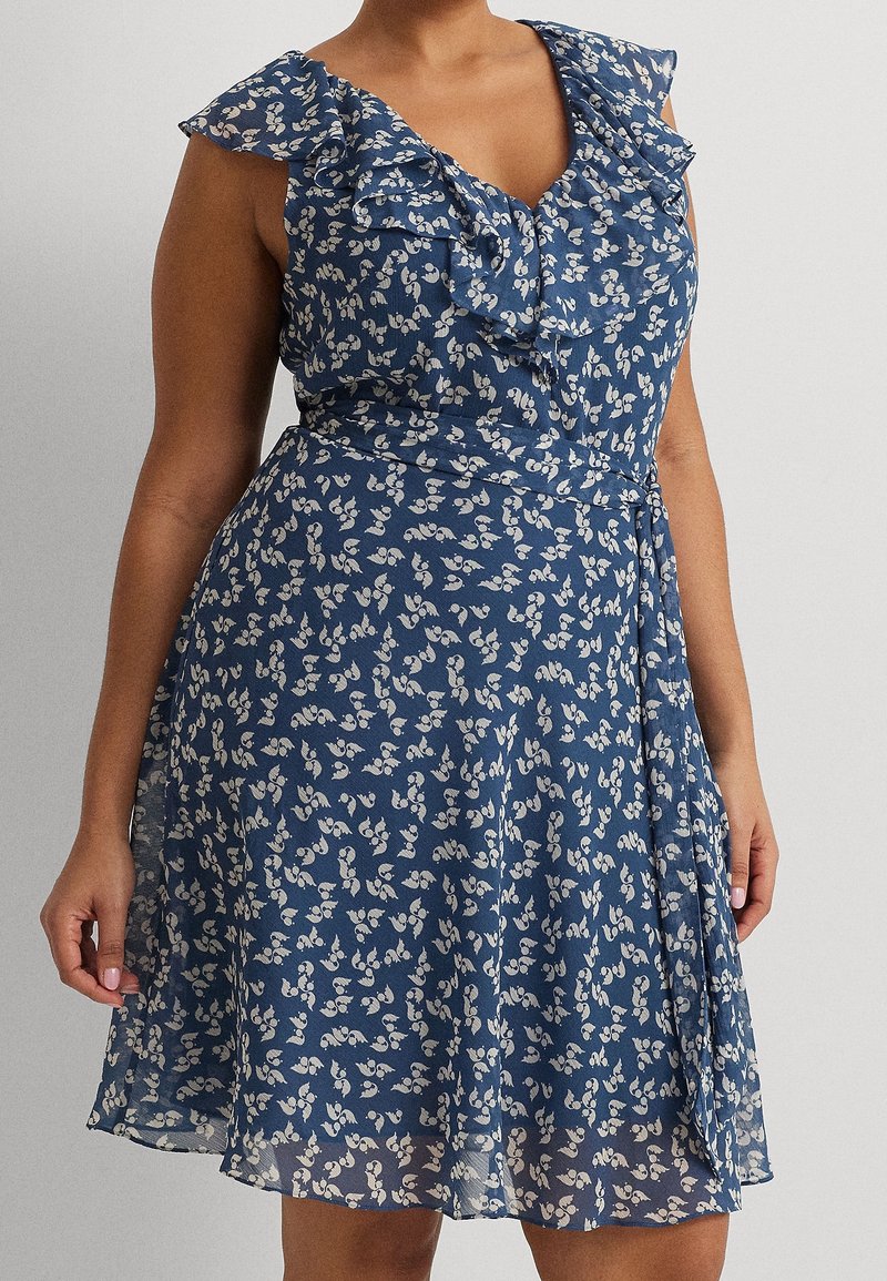 Blue floral dress with ruffled cap sleeves, V-neckline, and a flowing skirt. Lightweight fabric, featuring a small white floral pattern.